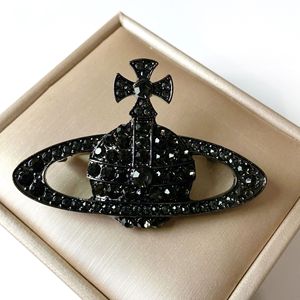 Broche Luxuoso Planeta Saturno com Design de Cruz, Acessório Elegante de Moda para Mulheres - Product Image 4