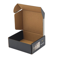 Boîtes d'expédition personnalisées pour ampoules LED, en carton ondulé recyclé, finition mate noire, pour appareils électroménagers, emballage moderne et luxueux.