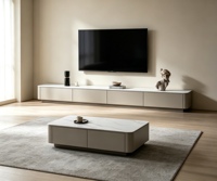Ensemble moderne de meuble TV et table basse en pierre frittée, avec coins arrondis et rangement intégré pour salon