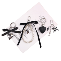 Nouveau porte-clés rétro en tissu noir avec pendentif cœur, porte-clés de couple, porte-clés polyvalent pour sac de voiture