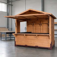 Kiosque pliant en bois pour stand alimentaire de Noël, utilisation événementielle ou en marché.