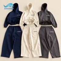 Ensemble de survêtement streetwear deux pièces pour homme, personnalisable, comprenant un sweat à capuche épais et un pantalon de survêtement ample à jambes larges, modèle uni