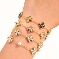Bracelet tendance à quatre pétales de fleurs, style européen, en acier inoxydable plaqué noir avec accents de zircon pour femme