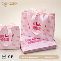 Sacs cadeaux en papier personnalisés avec ruban en satin imprimé nœud rose élégant, emballage en gros avec nom personnalisé pour les boutiques de détail