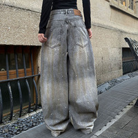 Pantalon en jean rétro déchiré style urbain - Pantalon ample à jambe large avec boutons style avion et effet encre, unisexe