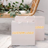 Sac en papier blanc de luxe personnalisé pour le shopping, avec poignée en ruban, logo imprimé, pliable, sac en papier artistique populaire pour boutique