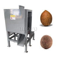 Machine à éplucher les cosses de noix de coco à performances stables/décortiqueuse de noix de coco/machine à éplucher les cosses de noix de coco