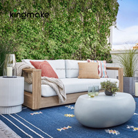 Table basse moderne en béton durable, forme pierre, pour balcon et terrasse d'hôtel, idéale pour un usage quotidien