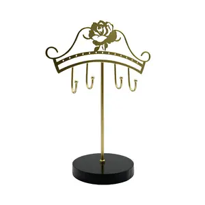 Soporte de joyería de metal dorado personalizado al por mayor Forma de cara multifuncional para el hogar, dormitorio