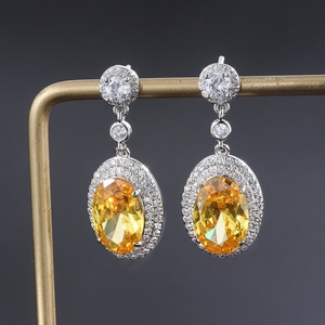 Venta al por mayor de fábrica: Conjunto de pendientes y collar de circonita cúbica amarilla de 8*12mm con engaste ovalado chapado en oro y cobre, ecológico y de moda. - Product Image 5