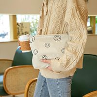 Sac de maquillage et trousse à cosmétiques pour femmes avec un design esthétique, motif visage mignon, fermeture à glissière (beige)