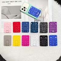 Support de téléphone portable universel 2-en-1 en silicone coloré, anti-perte, avec base stable et ventouse puissante réglable pour bureau/table