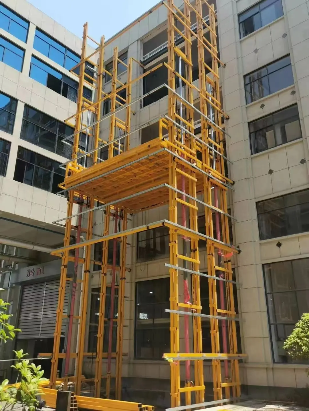 Plataforma elevadora eléctrica motorizada de mercancías manuales hidráulicas verticales de 3 pisos, 500kg, 10m, para carga en almacén