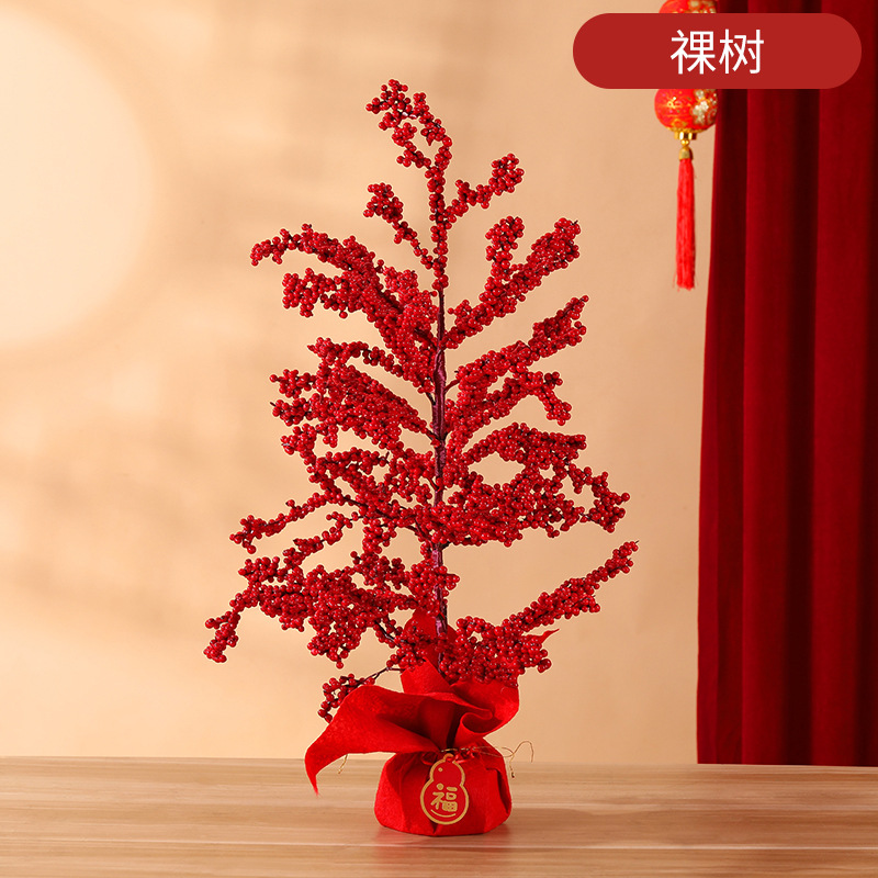 Arbre nu aux fruits rouges porte-bonheur