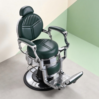 Fauteuil de barbier robuste vert, dossier rond avec surpiqûres géométriques, accoudoirs cantilever chromés et base noire.