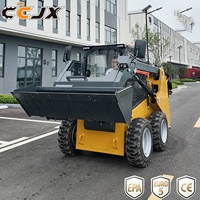 Mini-chargeuse compacte professionnelle avec cabine chauffée, 4 roues motrices, transmission hydraulique pour travaux de construction en hiver dans les régions froides
