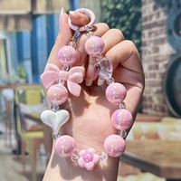 Chaîne de perles colorées en forme de cœur avec nœud - Accessoire mignon et tendance pour sacs de filles, coques de téléphone, etc.
