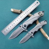 Couteau pliant multifonctionnel d'extérieur tout acier, portable et polyvalent, adapté au camping, à la maison et à la coupe des fruits.