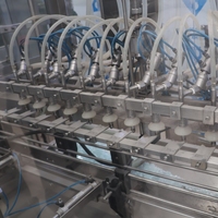 Machine de remplissage linéaire entièrement automatique d'occasion en acier inoxydable pour bouteilles, idéale pour l'huile comestible et les jus – Équipement de mise en bouteille quotidien