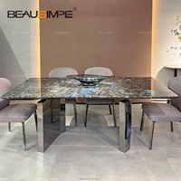 Ensemble de table à manger de luxe au design italien moderne avec plateau en marbre et pieds en acier inoxydable pour salle à manger