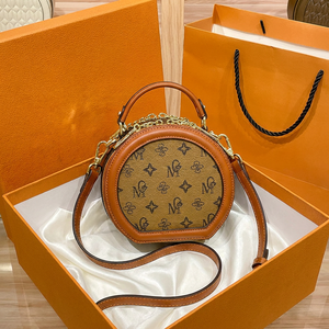 Sac à main rond <span class=keywords><strong>de</strong></span> luxe haut <span class=keywords><strong>de</strong></span> gamme <span class=keywords><strong>en</strong></span> cuir véritable <span class=keywords><strong>de</strong></span> vachette, style boîte-chapeau, vente <span class=keywords><strong>en</strong></span> gros d'usine, sac bandoulière pour femme - Product Image 1