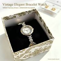Montres pour femmes en alliage personnalisées OEM, élégantes, avec bracelet en strass, montre rétro argentée et dorée bicolore, vente en gros
