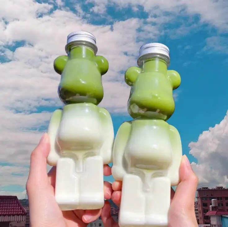 Çekici moda tasarım ayı şekli PET şişe hayvan plastik süt suyu 350ML 500ML 700ML süt çay bal ayı şişe