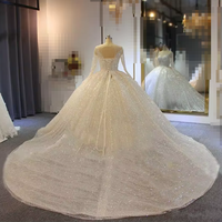 Robes de mariée personnalisées scintillantes style robe de bal, col bijou transparent, appliqués de paillettes, manches longues, robes de mariée en dentelle