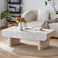 MEUBLES JIAMEIJIA |   Table basse effet travertin à façade cannelée et coins arrondis