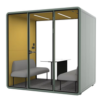 Cabine insonorisée double avec porte vitrée, deux sièges, éclairage de bureau et panneau d'alimentation pour salle de réunion
