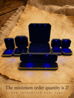 Boîte à bijoux LED octogonale noire avec bord doré, emballage cadeau pour présentation en magasin