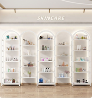 Vitrine de présentation cosmétique modulaire de luxe en forme d'arche avec éclairage LED, étagères métalliques pour salon de beauté et magasin de soins de la peau