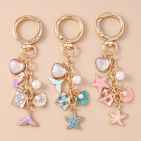 Porte-clés en métal émaillé sur le thème de l'océan, en gros, avec coquillages, coeurs, étoiles de mer, perles et sirènes, breloque compacte pour sac et pendentif