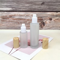 Pots en verre dépoli personnalisés recharge de lotion pour soins de la peau transparente couvercle de grain de bois pots en verre de crème au beurre pour cosmétique en vente en vrac