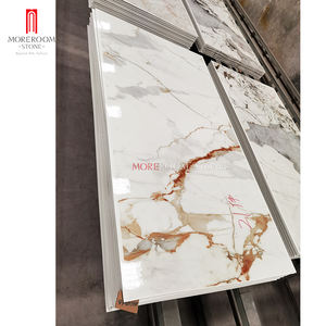 Carreaux Foshan 1200x2400mm grand panneau mural en porcelaine or Calacatta grande dalle pour salon - Product Image 1
