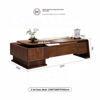 Bureau de direction contemporain avec tiroir de rangement surélevé et design en bois veiné aux bords arrondis