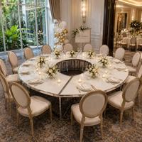 Nouvelle table de réception ovale en acier inoxydable argenté avec plateau en verre blanc, capacité 15 personnes, idéale pour les fêtes, hôtels, banquets, mariages et événements.