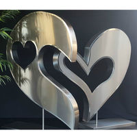 Grande sculpture extérieure en forme de coeur en acier inoxydable poli miroir sur mesure
