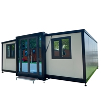 Maison conteneur en acier extensible à double aile de 20 et 40 pieds de haute qualité avec panneau sandwich au design moderne pour le camping et le bureau de chantier