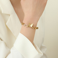 Bracelet tendance pour le quotidien en acier inoxydable et titane, avec motif papillons ailés plaqué or, style délicat et frais
