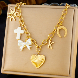 Collier de mode en acier inoxydable à plusieurs niveaux plaqué or à la mode avec des breloques de chaîne d'oeil de croix de cerise de coquille de nœud de coeur - Product Image 6
