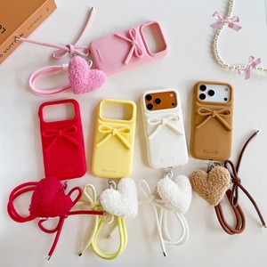 Nouvelle coque de téléphone portable en silicone souple 3D couleur bonbon avec nœud, pour <span class=keywords><strong>iPhone</strong></span> 16 Plus 17 15 14 Pro Max, avec cordon pendentif cœur et couverture arrière - Product Image 1
