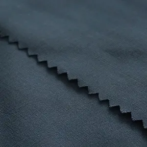 वाटरप्रूफ टैक्टिकल पैंट गारमेंट्स रिपस्टॉप स्ट्रेच फैब्रिक चीन फैक्ट्री पॉली कॉटन 220gsm क़िंगदाओ बुना सादा रंगे 4 ग्रेड