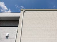 Revêtement mural extérieur moderne en panneaux de fibres-ciment écologiques, ignifuges et sans amiante pour maisons préfabriquées et gymnases