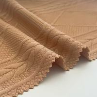 ANONO Nouveau produit Lots excédentaires Polyester Spandex Jacquard tricoté Tissu de sport personnalisé pour vêtements Tissus textiles