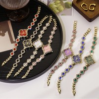 Montre à quartz pour femme en alliage, bracelet trèfle tendance, pierres précieuses colorées, best-seller, vente en gros en direct