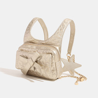Sac à dos en PU avec nœud pour femme, nouvelle collection été 2024, petit sac de voyage haut de gamme à bandoulière unique avec chaîne, fermeture éclair