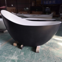 Baignoire autoportante ovale haut de gamme de luxe écologique en pierre artificielle à surface mate noire pour hôtel contemporain