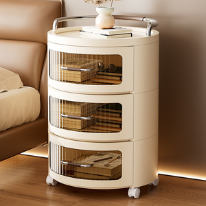 Cream Colored Round Storage Cabinet With Drawers And Wheels For Bedroom Or Living Room Use - Product Image 2