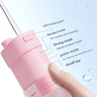 Hydropulseur électrique portatif 4 buses de remplacement Irrigateur pratique IPX7 Irrigateur oral sans fil étanche Flosse à eau